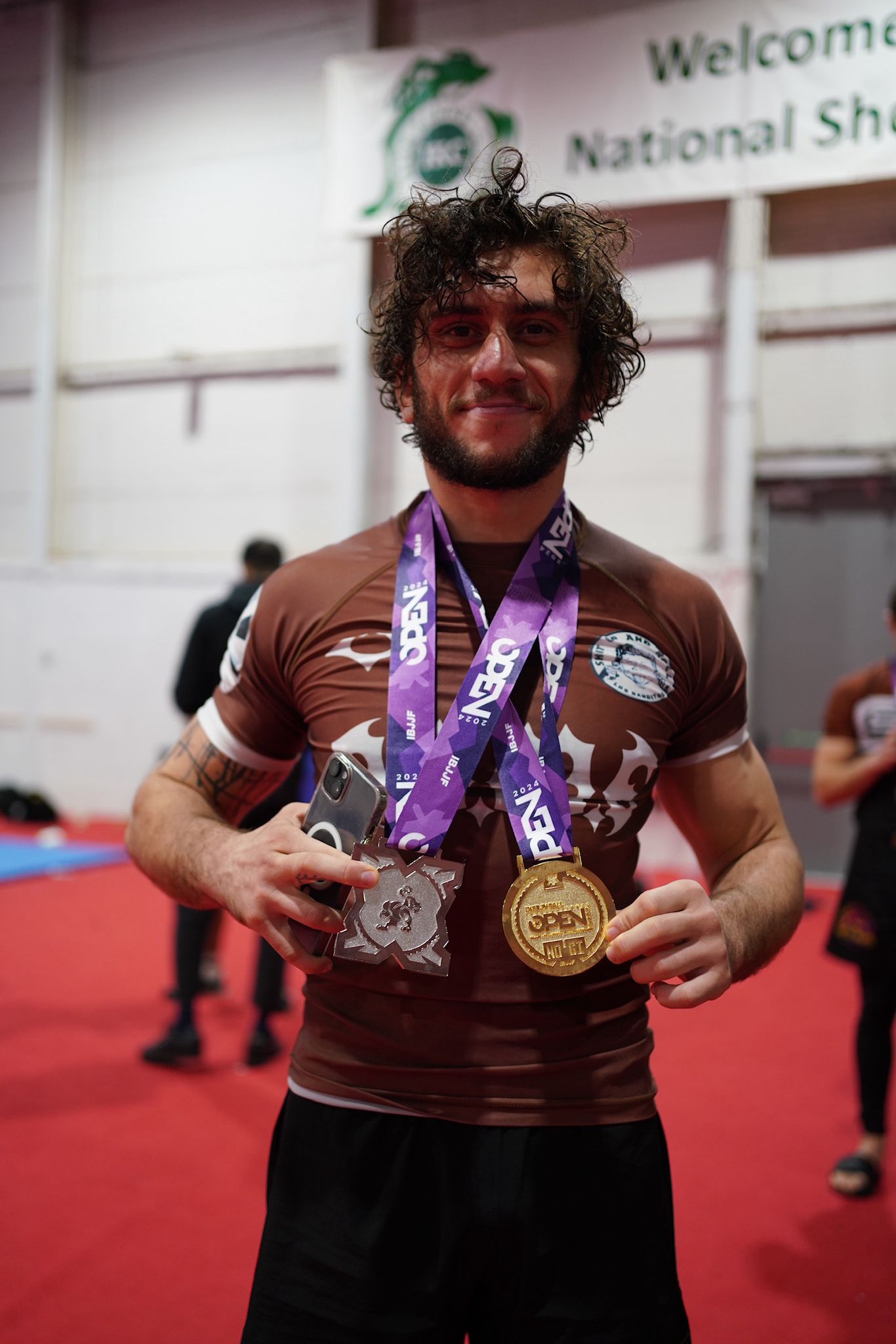 Sebastian Curelao displaying multiple championship medals