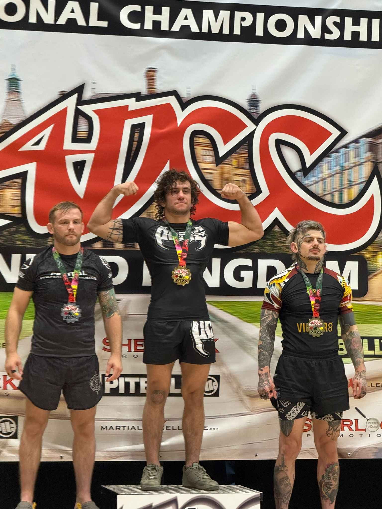 Sebastian Curelao on championship podium with gold medal